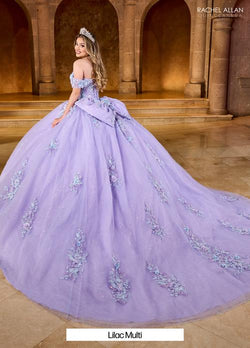 The gown features a soft pastel tulle layered with floral embroidery that adds a dreamy, whimsical touch. The off-the-shoulder neckline is elegantly designed with sheer sleeves that add a touch of sophistication Style #: RQ1153